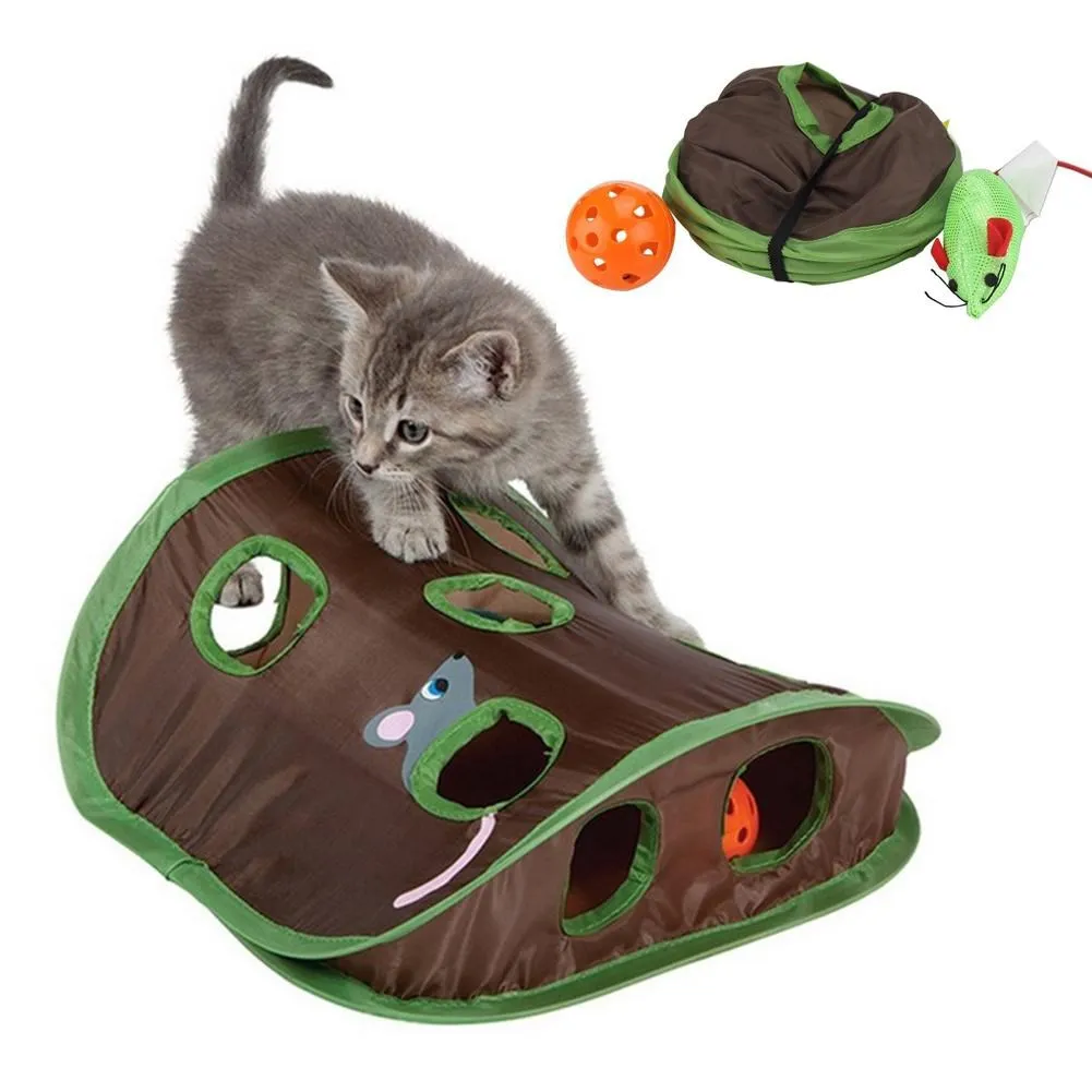 A gray kitten frolics on a Cute Pet Cat Interactive Hide Seek 9 Holes Tunnel with a mouse design. Nearby, an orange ball cat toy adds to the fun, creating the perfect setting for playful kitten adventures.